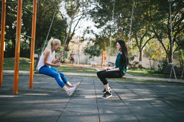 Couple talking on a swing after a discussion